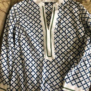 Top. Blue and white with green accents.